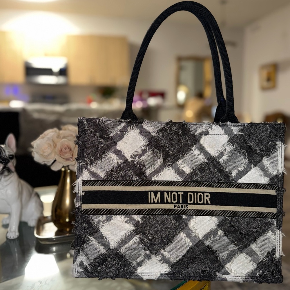 I’m not Dior medium book tote distressed denim